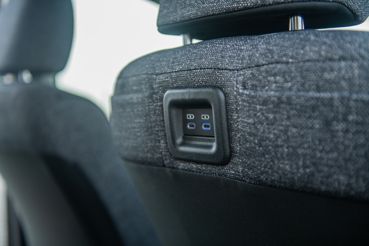 Two USB Type C ports and smartphone pockets on driver seatback