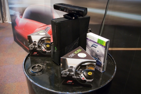 See that black bar perched atop the Xbox 360? That is the Kinect sensor which FM4 will be using for several features. It will allow you to “walk” around a car in a virtual showroom, crouch 
down to look at the details, or open the doors and hood by reaching out with your hand. It also features head-tracking, which pans the in-car camera view based on where your head is pointing. The Kinect sensor also allows you to navigate the game’s menu by voice control and even play the game without having to use a controller (we didn't get to test this out but it sure sounds funny). 