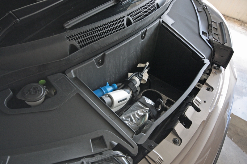 A compartment to store charging cable and tools