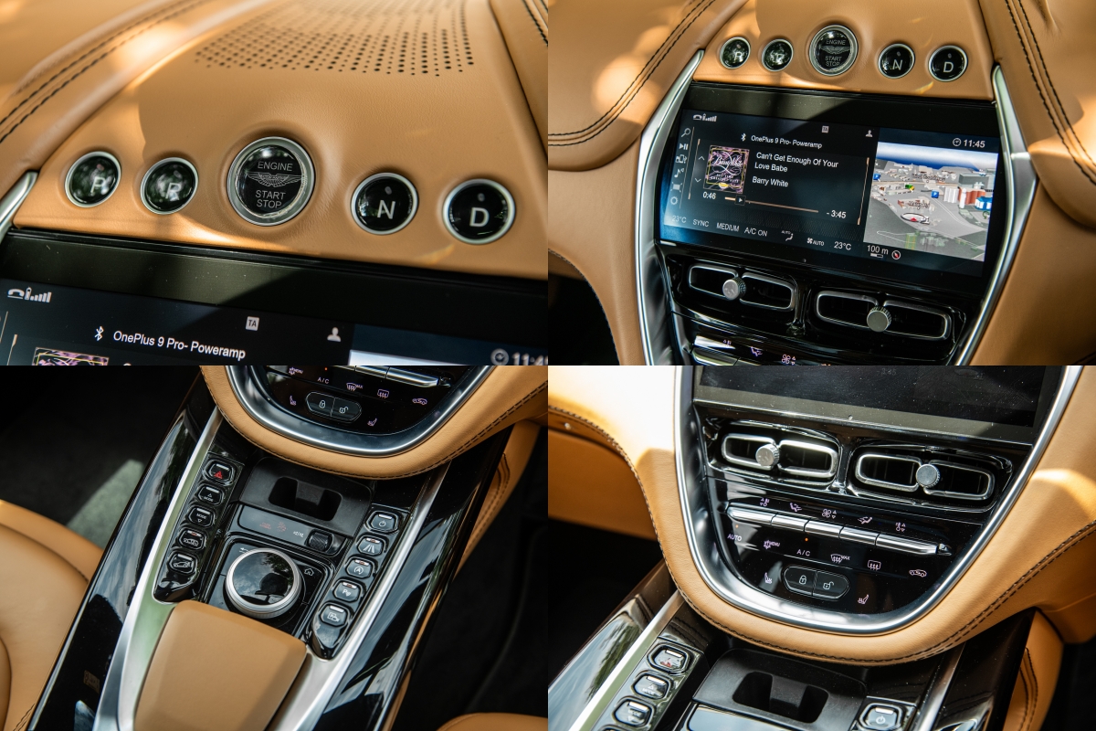 clockwise from top left: gear selector buttons, non-touchscreen infotainment screen, physical climate controls, infotainment rotary knob, buttons for other functions