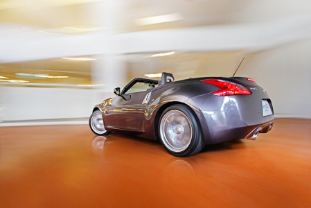 Like the coupe, the 370Z roadster is similar in dimensions save for the fact that it had its top chopped and replaced with a fabric folding roof that comes with a standard automatic latching power top. The 370Z roadster also boasts of an aluminium hood, door panels and trunk for better power to weight ratio while at the same time, the body structure's rigidity and stability were improved on, with additional structural reinforcement in both the A-pillars and side sills. 