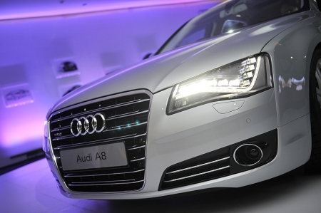 The new LED headlights give the new Audi A8 and A8 L (long wheelbase) an
unmistakable appearance in daylight and after nightfall. The revolutionary
optics used in these headlights is a departure from the tubular light modules
commonly used today. The Audi flagship combines a new level of technical intelligence with intuitively simple operation. Its multimedia interface (MMI) includes a pioneering innovation: in conjunction with the MMI navigation plus navigation (standard), it has a touchpad. The MMI enables the driver to control many functions intuitively. The navigation destination, for example, can be entered by tracing the letters on the pad with a finger. 