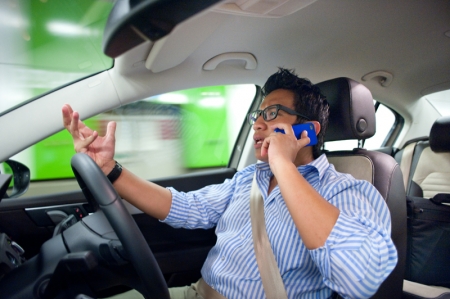 The Traffic Police has well justified their commitment in enforcing strict regulations on mobile phone driving, statutorily enacted in Section 65B of the Road Traffic Act, Chapter 276. This section states that, “Any person who, being the driver of a motor vehicle on a road or in a public place, uses a mobile telephone while the motor vehicle is in motion shall be guilty of an offence and shall be liable on conviction to a fine not exceeding S$1,000 or to imprisonment for a term not exceeding six months or to both, and, in the case of a second or subsequent conviction, to a fine not exceeding S$2,000 or to imprisonment for a term not exceeding 12 months or to both.” In addition, 12 demerit points would be charged to your traffic report card and your mobile phone will be forfeited by the court if convicted.