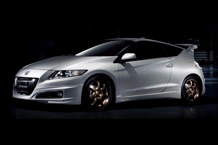 To make 10 years of Hybrid power a very special milestone to remember, Kah Motors will also offer a Mugen Aero Package for the Honda CR-Z. The first 10 CR-Z customers will get this package free. This Aero Package can be applied to 6MT and CVT models. The design concept of the Mugen Aero Package is “Sporty & Cool”. The package includes the following: Mugen front under spoiler, rear under spoiler, side under spoiler, front sports grille and rear wing. Designed and tested in the wind tunnel, the Aero Package not only enhances the sporty design of the 2012 CR-Z, it also generates additional down force from the rear wing, improving traction and high speed stability. 