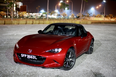 That said, there is no denying how the completely reworked and redesigned MX-5 now has a more aggressive stance: The hood slopes forward to a narrow cross-section front end that features the car’s blacked-out grille, which is then combined to a pair of restyled headlight cluster (featuring LED running lights). 
